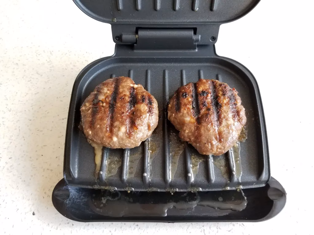 When should you flip a burger on a George Foreman Grill?