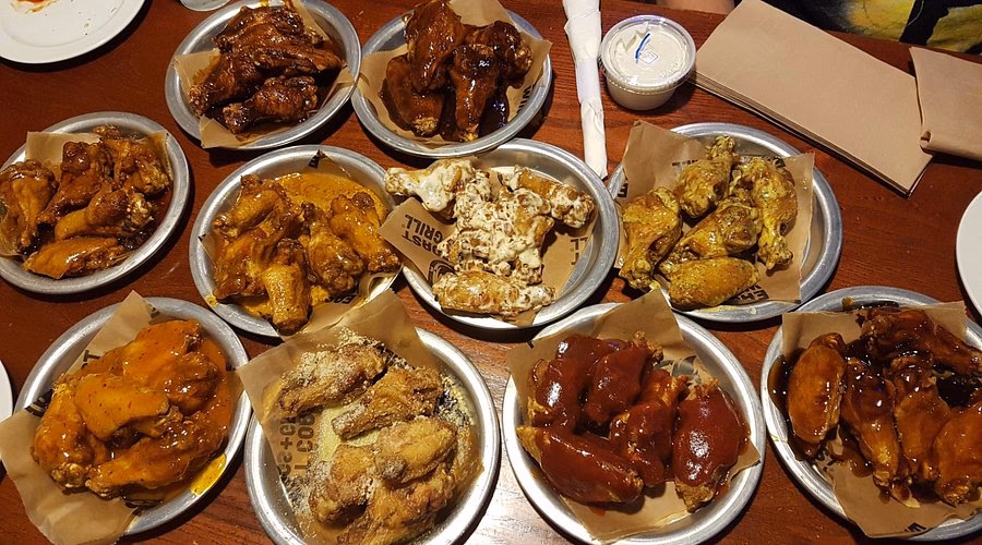 How many wing flavors does East Coast Wings & Grill have?