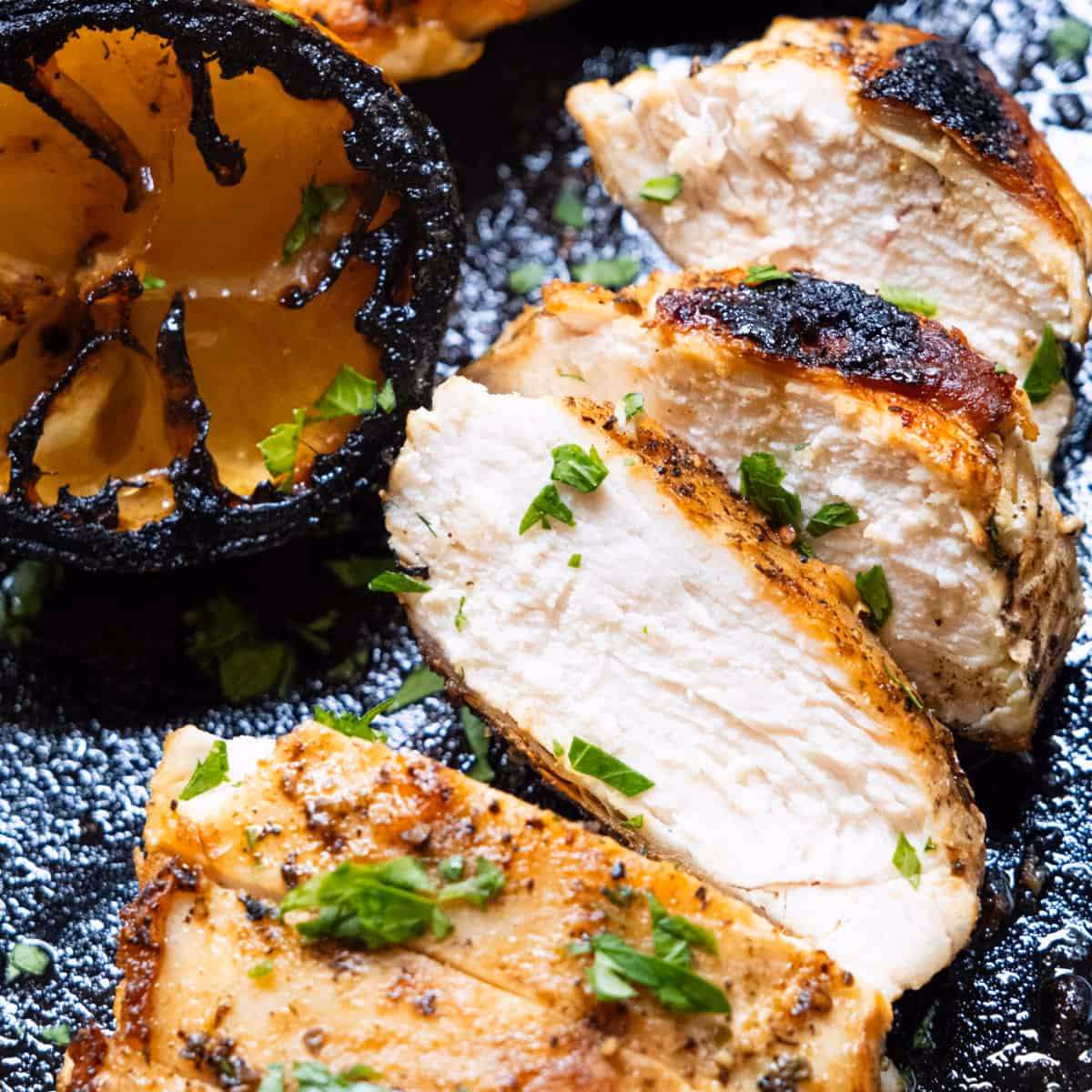How do you add flavor to grilled chicken on a flat top grill?