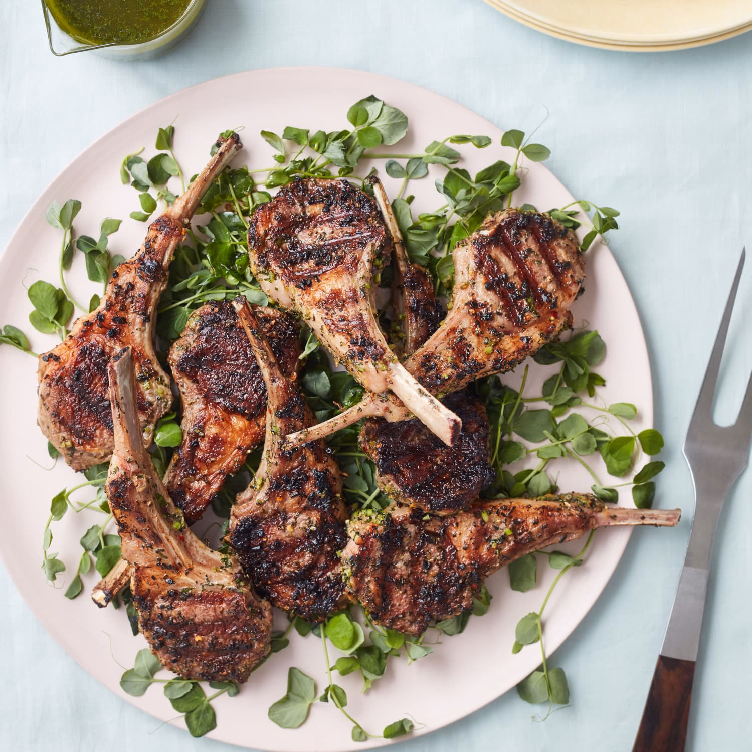 How do you preheat a gas grill before grilling lamb chops?