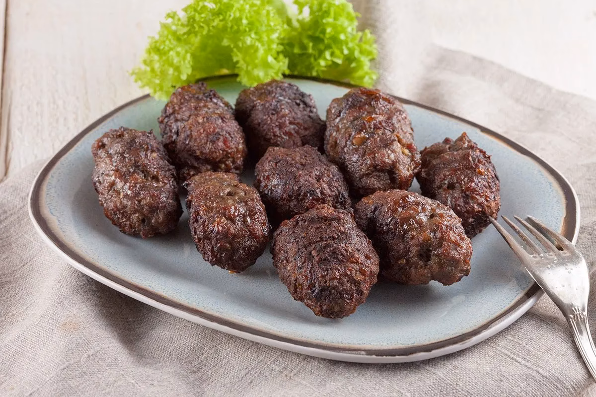 How do you cook mititei on a grill?