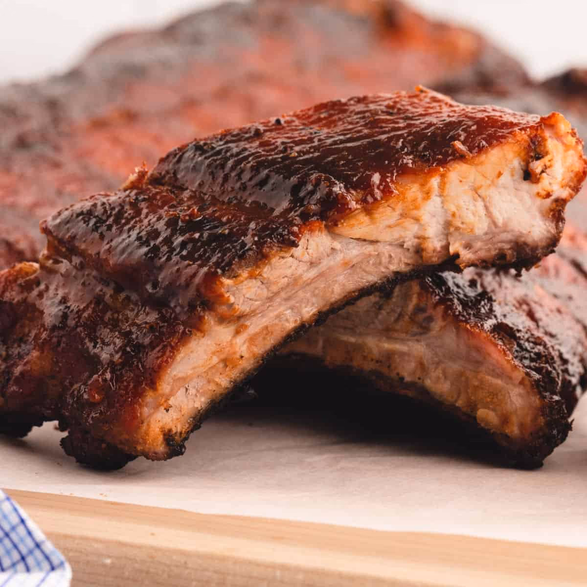 How long should ribs be wrapped before grilling?