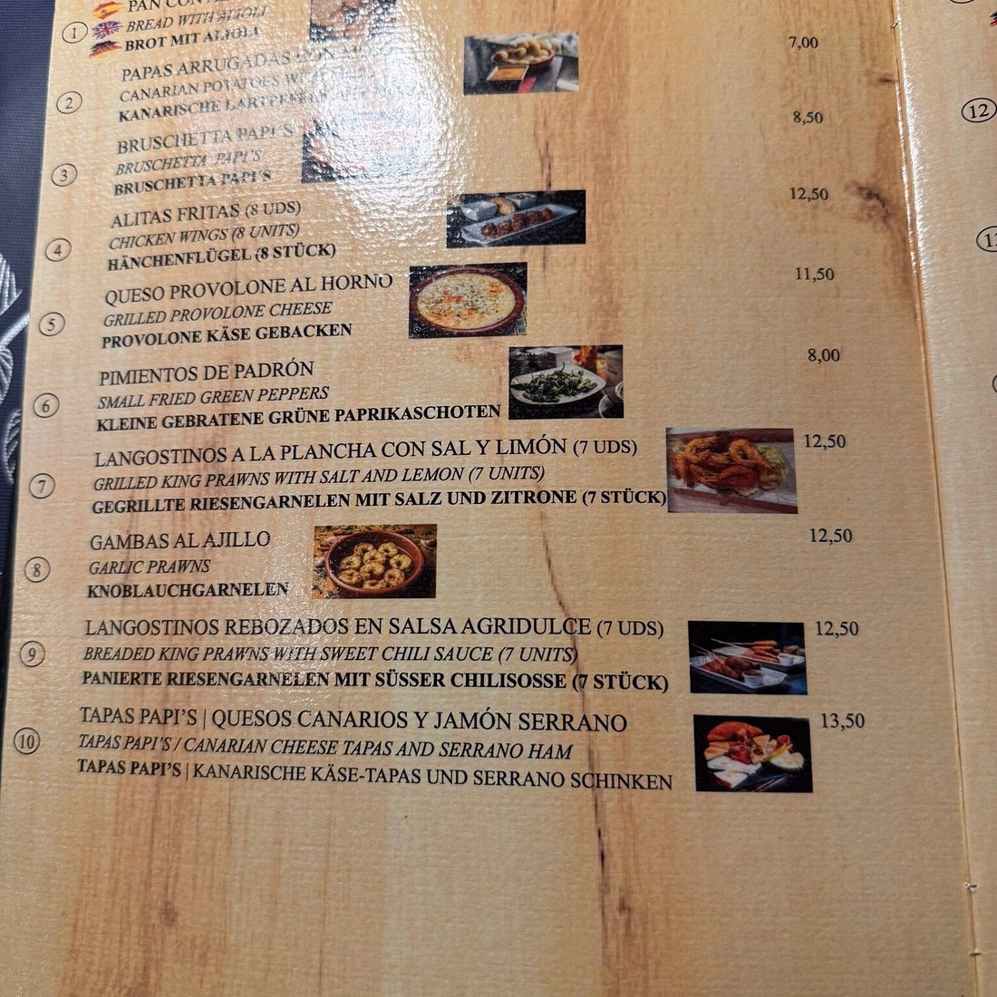 Why should you visit Papi's Grill Playa del Ingles?