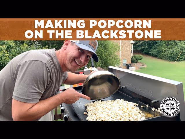 Wie kann ich die Popcorn-Kugel vom Grill nehmen?